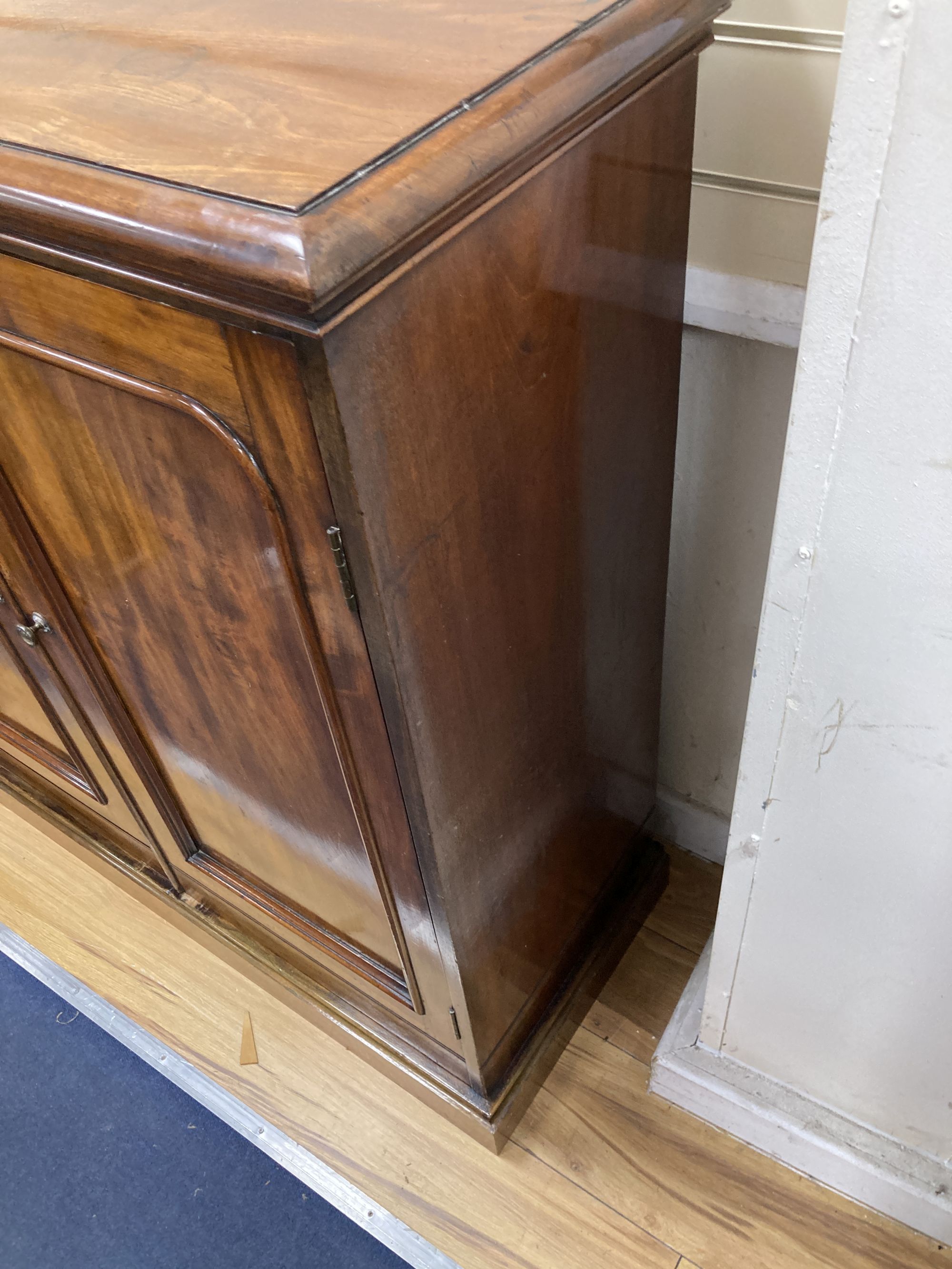 A Victorian mahogany two door cabinet, width 104cm, depth 42cm, height 110cm